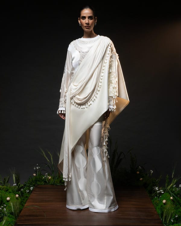 Saim — Sculptural necklace top + Tassel drape one shoulder + Outline godet trouser set